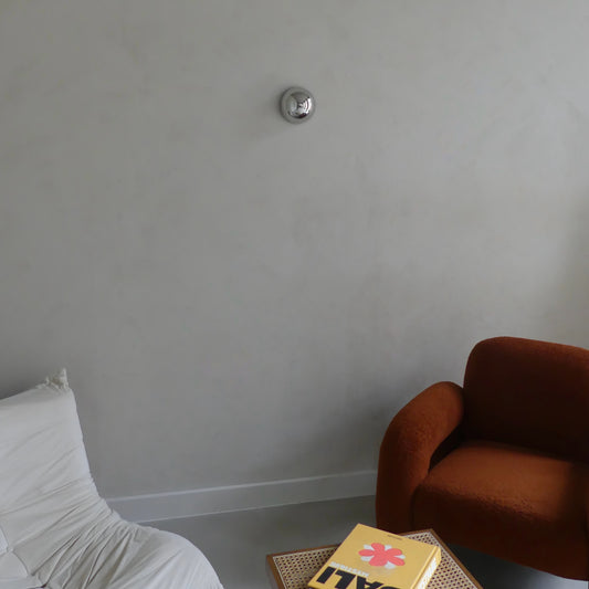 Lumevre convex mirror 15 cm mounted on a wall seen from a distance