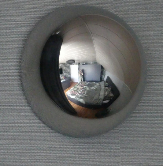 How one convex mirror completely changes the feeling in a room