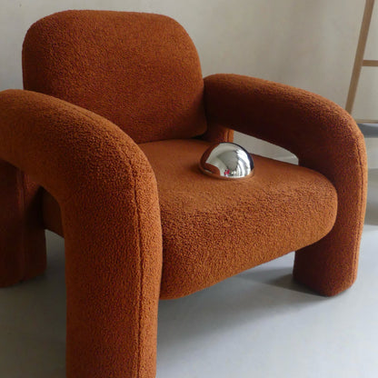 Lumevre convex mirror 15 cm resting on a chair seat to show its size
