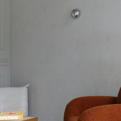 A side view of the Lumevre convex mirror 15 cm mounted on a wall