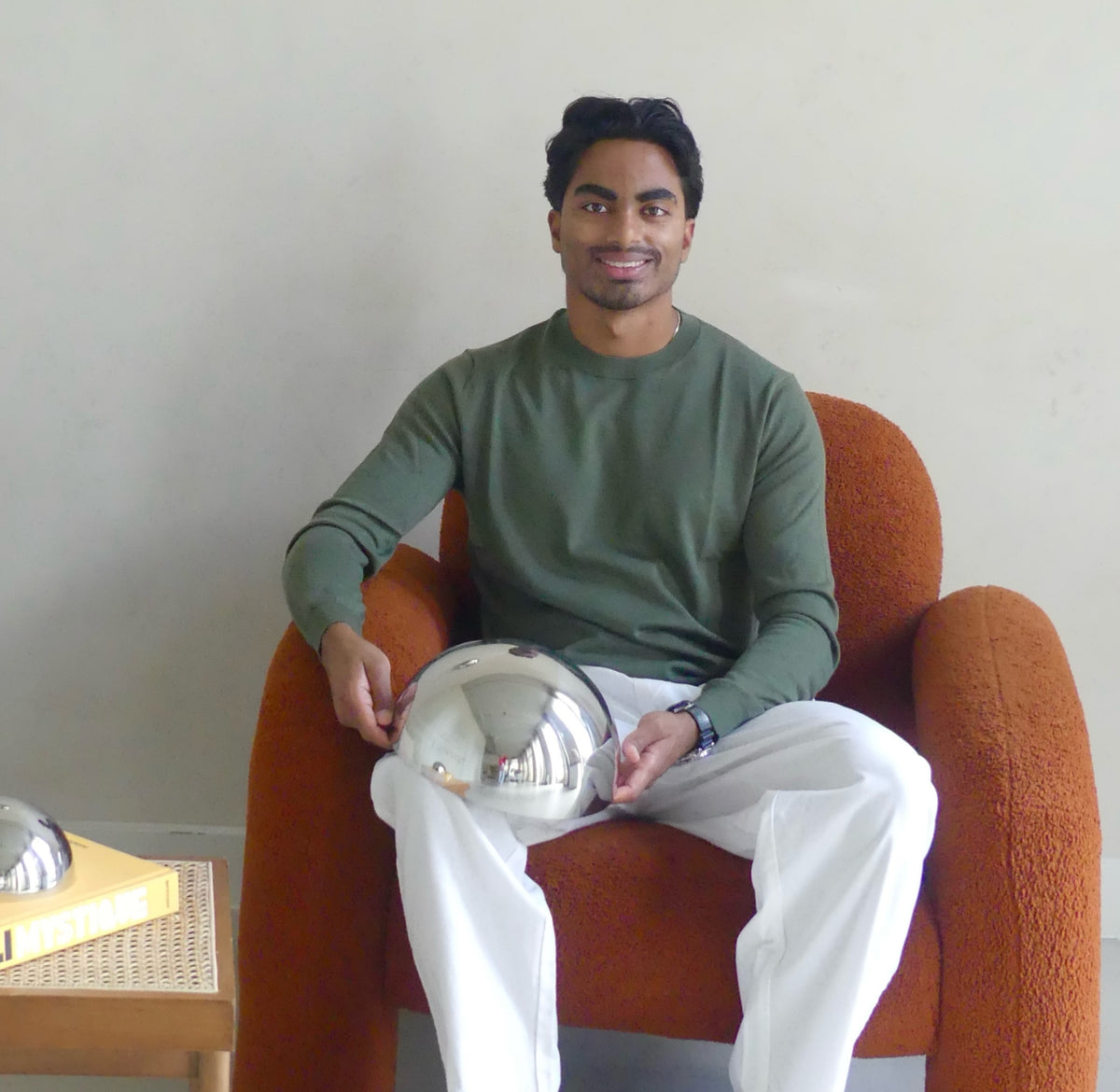 Surath, the founder of Lumevre, pictured with the 25 cm convex mirror in his hands