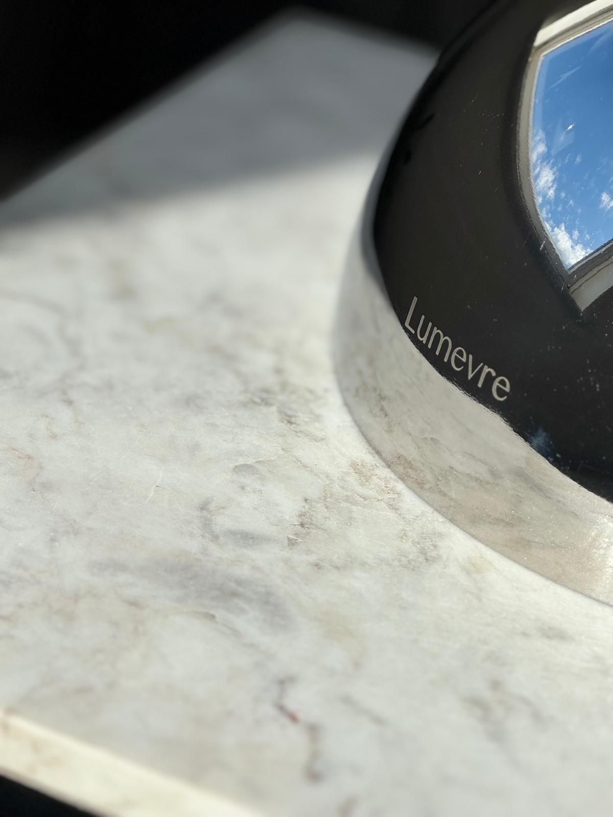 A closeup of the design of the Lumevre convex mirror, showing the engraved mirror side