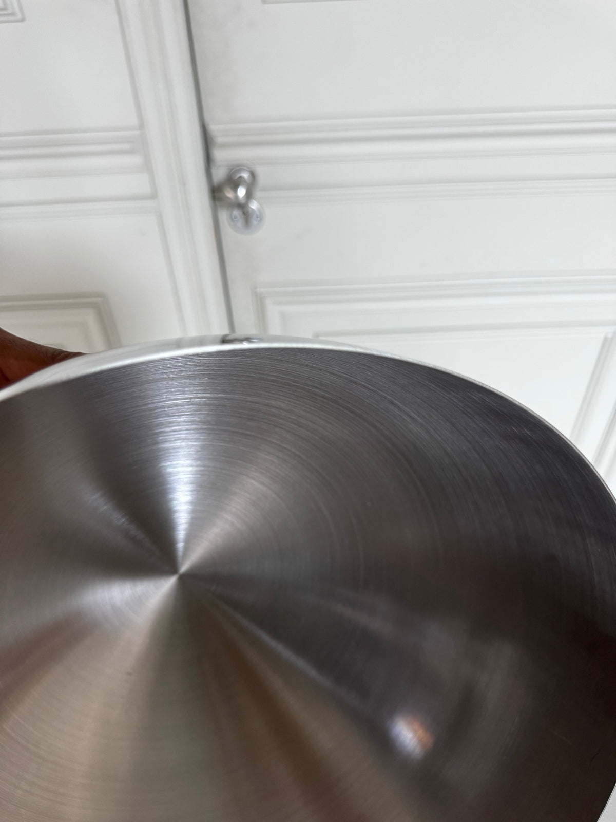 A closeup of the material used for a Lumevre convex mirror, displaying the thickness and finish