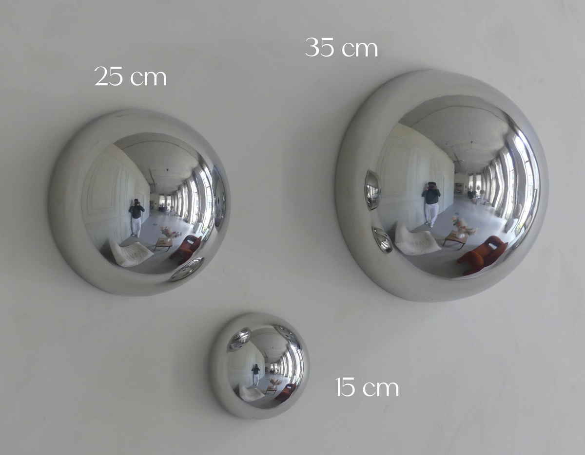 A size comparison between all Lumevre convex mirrors, positioned next to each other on one wall